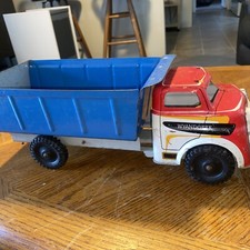 Vintage 50's era Wyandotte Pressed Steel Dump Truck with folding door gate Nice
