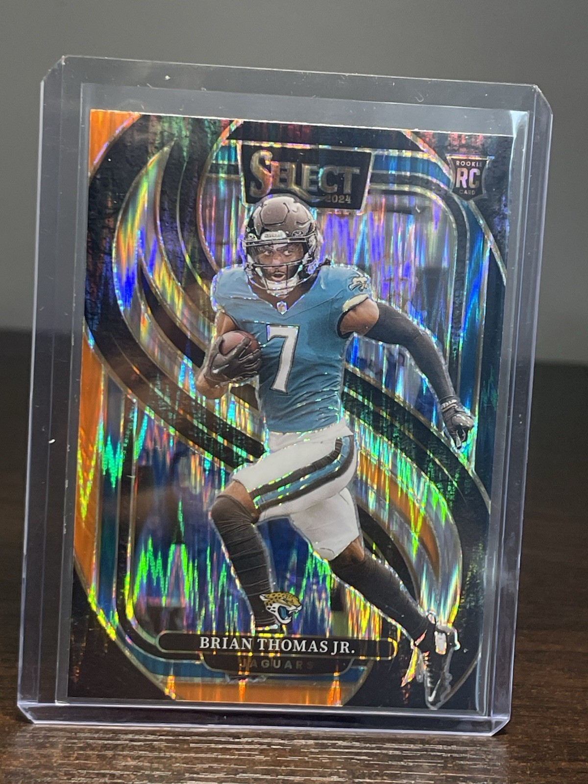 2024 Panini Select Premier Level Brian Thomas Jr. Black & Orange Shock Prizm