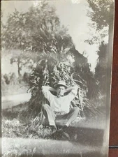RPPC REAL PHOTO POSTCARD Man Relaxing on Cornstalks Farm