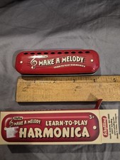 Learn how to play harmonica great condition in box 4" across SCHYLLING
