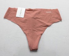 Calvin Klein Women's Microfiber Seamless Invisibles Thong Panty ZG3 Peach Small