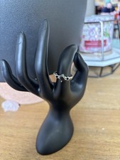 Silver Band Ring with Green Gemstone and Clear Accent Stones