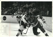 1993 Press Photo Hockey players David Oliver and Doug Wood in action during game