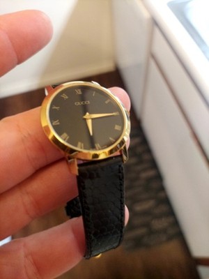 Gucci Swiss Made Quartz Analog Watch Gold Tone Case Black Dial Roman Numerals