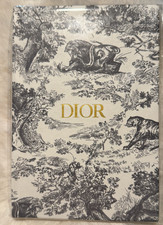 Christian Dior notebook adorned with the brand's signature Toile de Jouy motif.