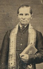 PRIEST HOLDING BIBLE, CRAZY EYES AND EXPRESSION. CDV BY FLEISCHER.
