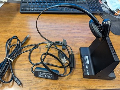 Plantronics headset , includes charging station and power cord