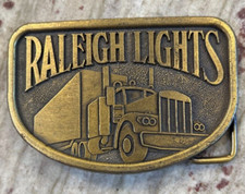 Vintage Raleigh Lights Belt Buckle Collectible Unique Trucker