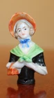 VTG PORCELAIN GERMANY HALF DOLL WEARING AN ORANGE BONNET GREEN SHAWL & BLUE BOW