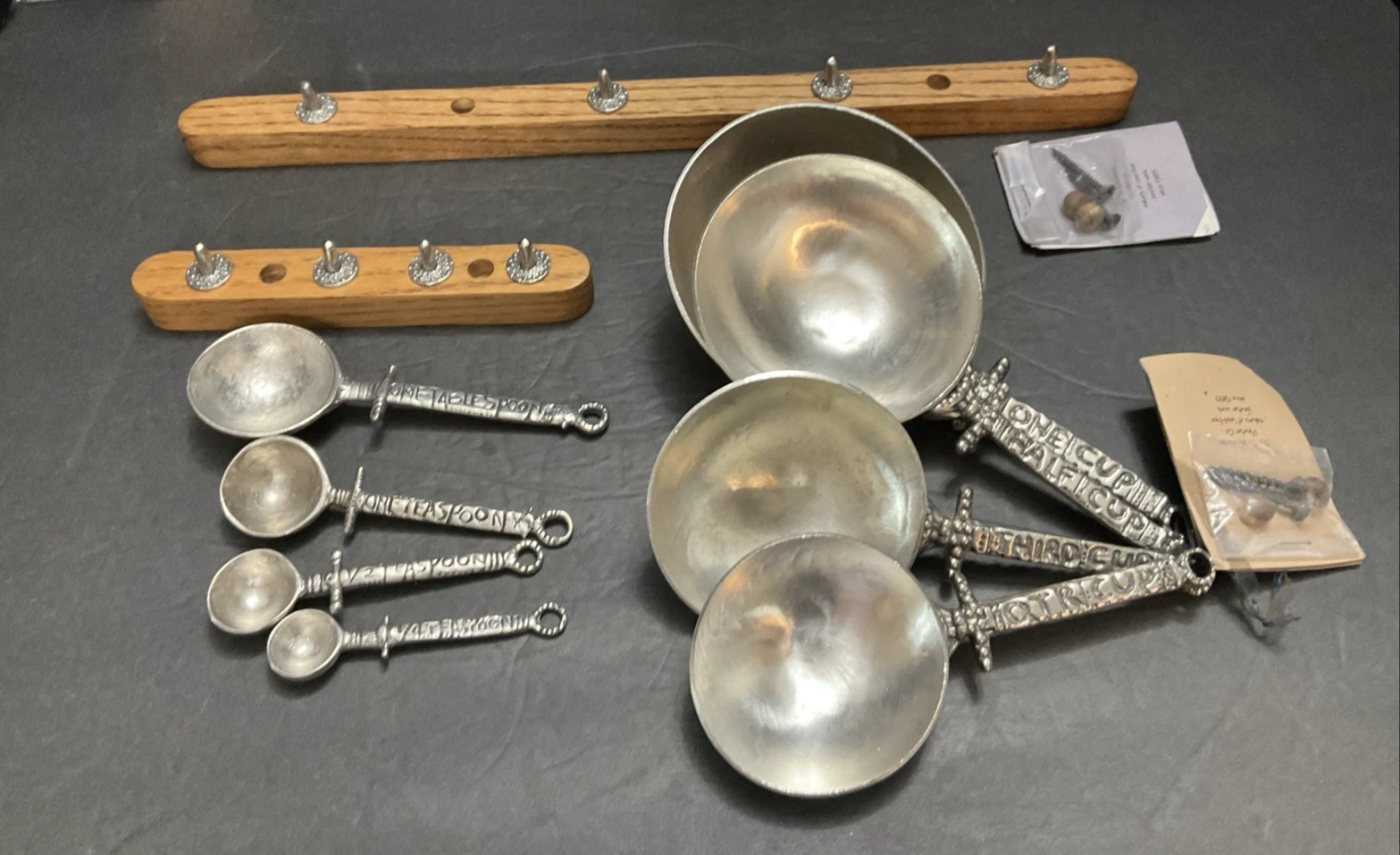 The Tin Woodsman Pewter Co. Measuring Cups and Spoons Set w/Oak Hangers
Opens in a new window or tab