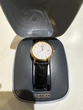 Seiko Quartz Watch white dial and a black leather strap 