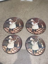 SET OF 4, ROUND STOVE TOP BURNER COVERS.