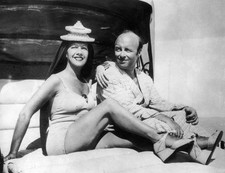 French soprano Lily Pons relaxing on Miami beach with her husband - Old Photo