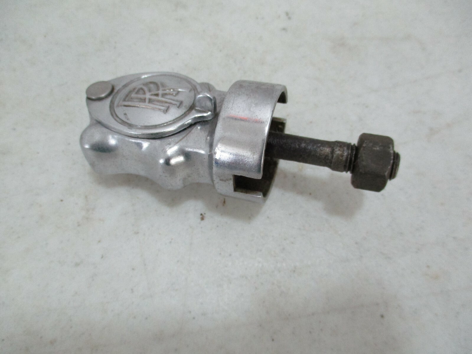 Vintage Rolls-Royce Phantom III starting crank guide under the center spot light
