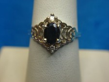 STERLING SILVER RING WITH BLUE SAPPHIRE - PRETTY SETTING. - SIZE 8