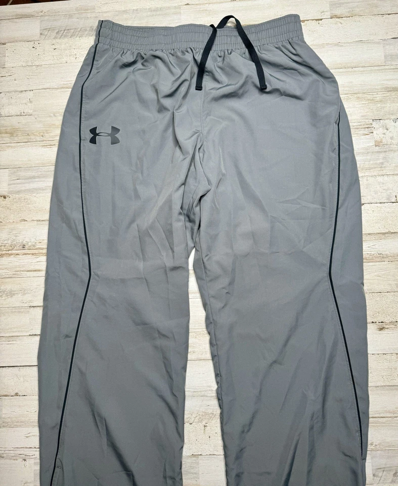 Pantalones cortavientos Under Armour para hombre XL gris forrados de malla bolsillos con cremallera pista Foto 3 de 4