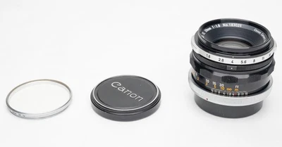 Canon FL 50mm f1.8 manual focus lens with Canon filter & caps. - Image 1 of 4