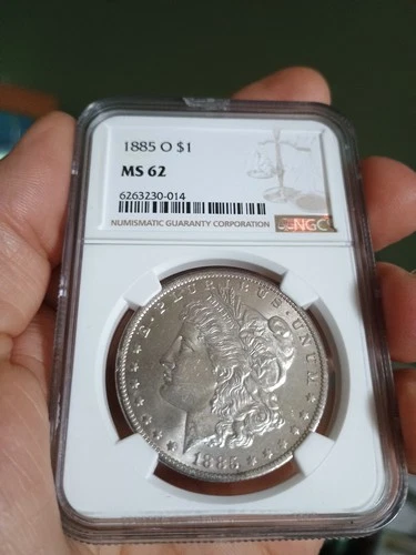 1885 O $1 MS62 Silver Morgan Dollar. Reverse Has Purple Eclipse Toning Starting