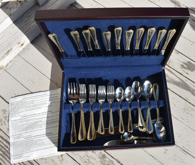 International Stainless-Steel Flatware with Wood Case gold tone trim 68 pieces