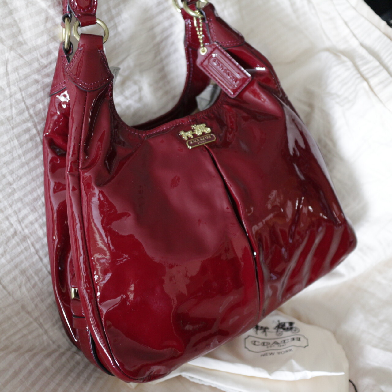 shiny red coach purse