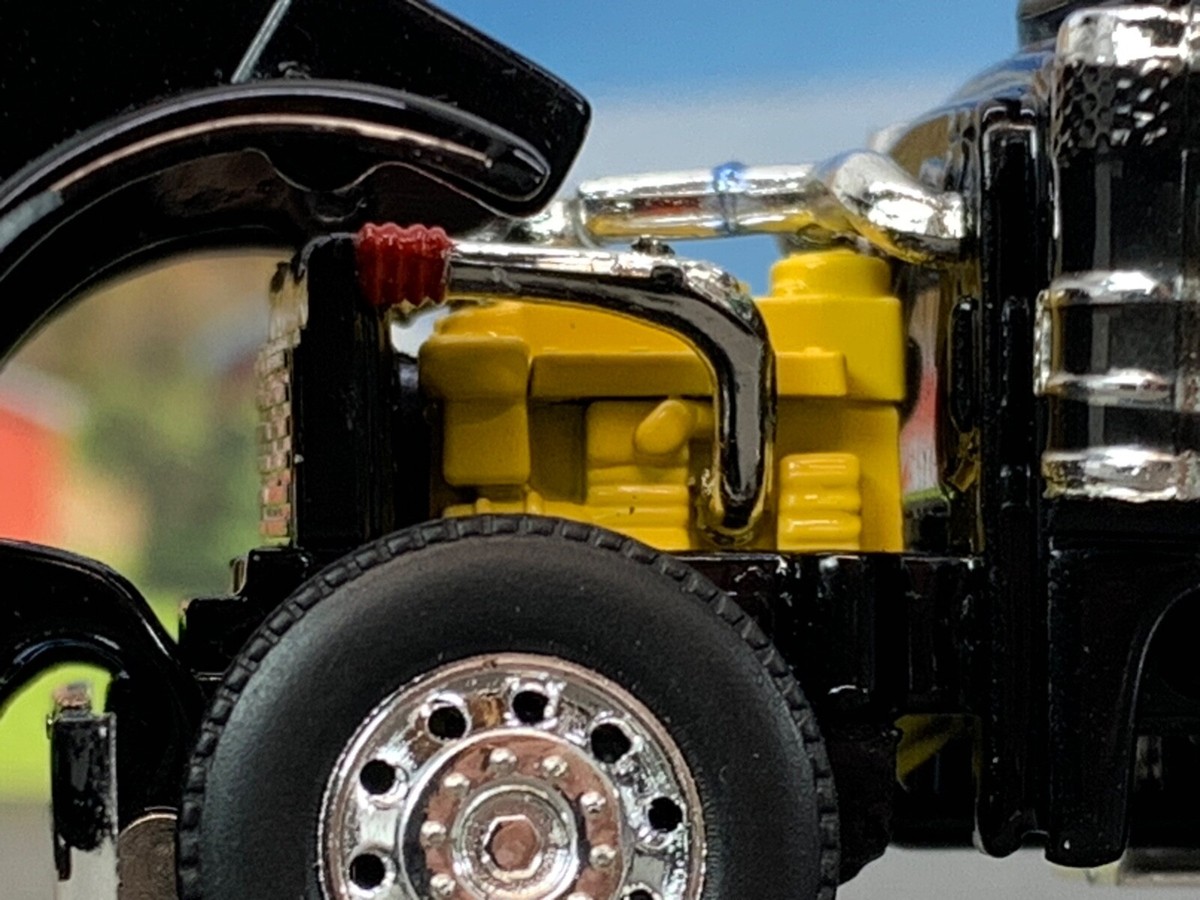 1/64 DCP BLACK PETERBILT 379 TRI AXLE 63