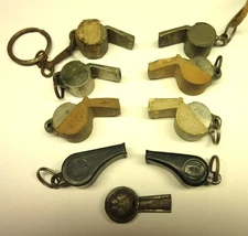 (9) Acme Thunderer Whistles. Small Metallic and plastic vintage whistles.