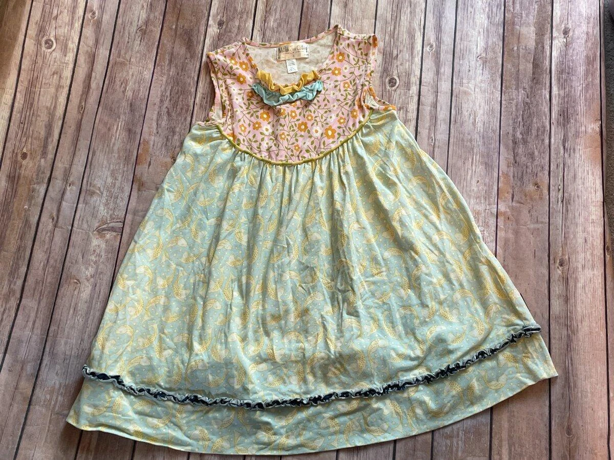 Green dress with yellow fish top