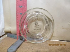 ASHTRAY , CLEAR GLASS WITH LAKE PLACID AND A FIGURE SKATER ON IT! 