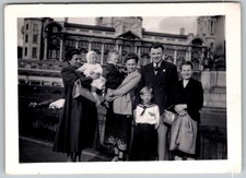Vtg B&W Snapshot Family Group Portrait Children Babies City Building Backdrop