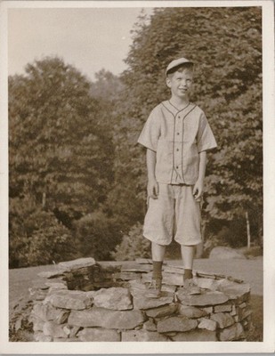 Vtg B&W Snapshot Boy in Baseball Uniform Standing On Stone Well 1940s