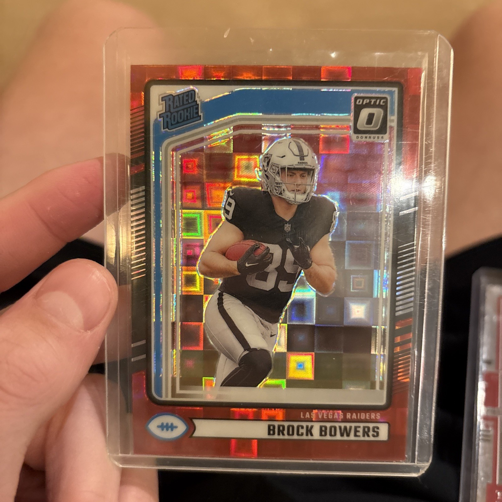 2024 Panini Donruss - RC  Brock Bowers #394 Optic Preview Red Pandora Prizm (RC)