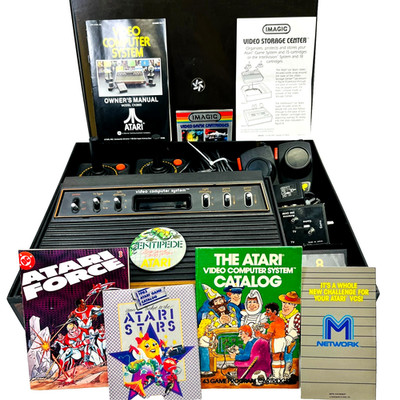 Atari 2600 Console Bundle: Joysticks, Paddles, Atari Force Comic, Organizer, Pin