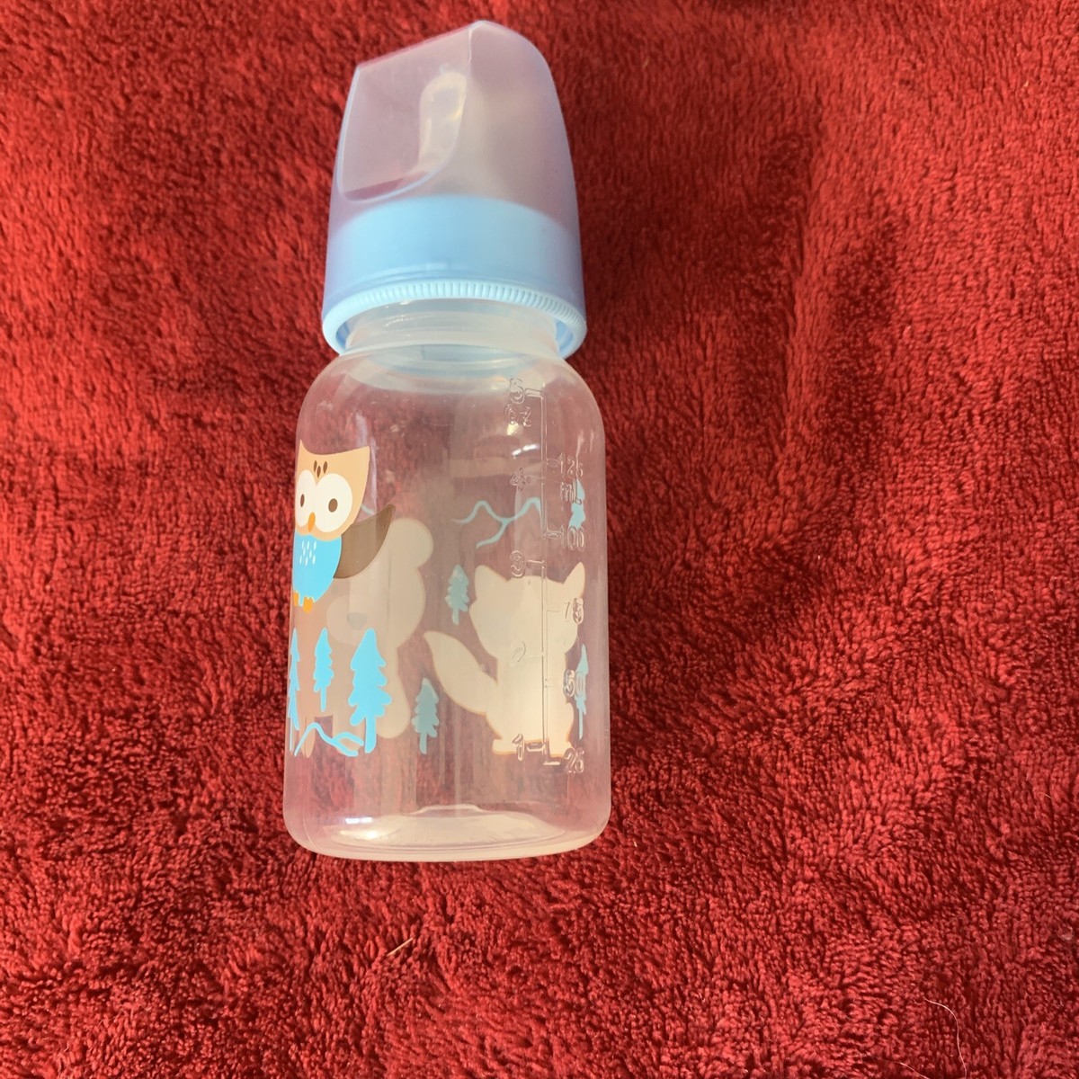 5 Oz. blue baby bottle with animals cute! Very light use at