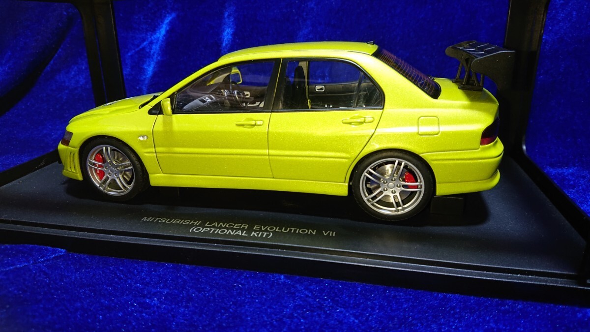 AUTOart Mitsubishi Lancer Evo VII Street Car Street Car with Optional Kit Mustard Yellow 77166