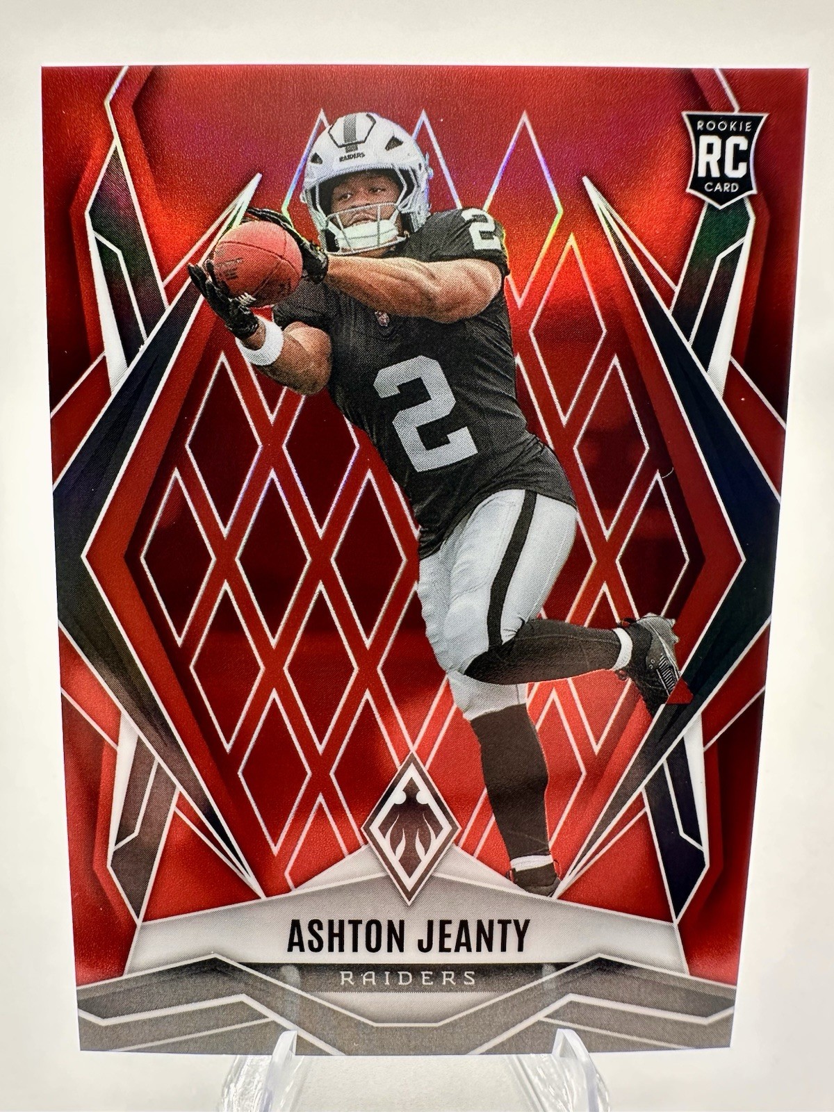 2025 Panini Phoenix -Rookies Ashton Jeanty #158 Red 32/99 (RC) Las Vegas Raiders