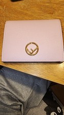 pink leather Fendi "F is Fendi" bifold wallet featuring gold-tone hardware