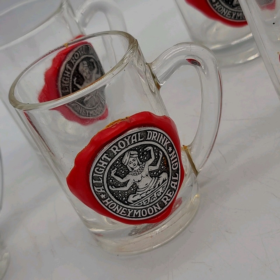 Six tiny Italian goddess-themed gin mugs from a honeymoon set — the kind of barware that stops a dinner party cold.