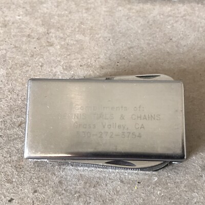 Dennis Tires & Chains Grass Valley CA. Promotional Multi Tool money clip