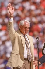Hall of Fame coach Bill Walsh speaks to the crowd during halftime - Old Photo