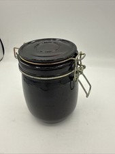 Vtg 6&rdquo; Black Glass Jar with Wire Bail Lid marked Pearl