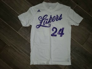 white and purple lakers shirt