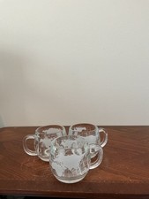 vintage 1970s Nestlé Nescafé clear glass world globe coffee mugs featuring a whi