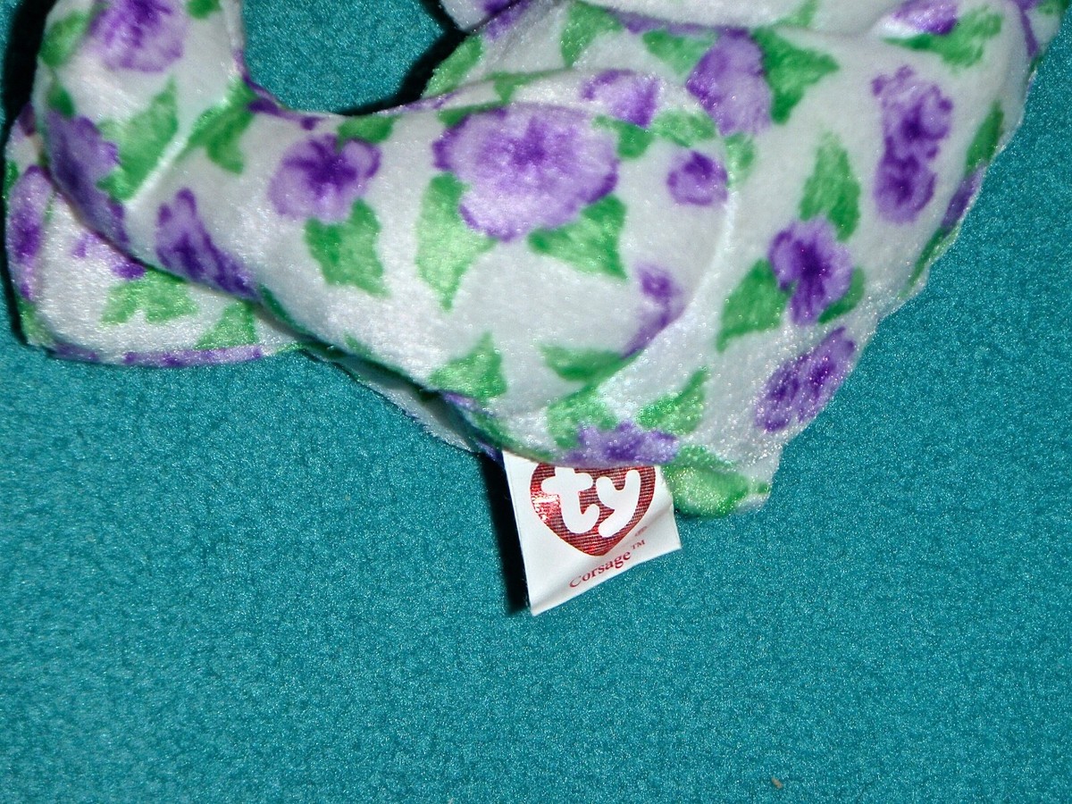 TY BEANIE BABIES CORSAGE BEAR HOLDING PURPLE & WHITE FLOWER
