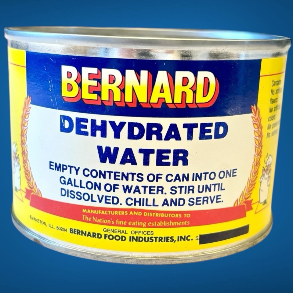 A sealed tin can of 'Dehydrated Water' by Bernard Food Industries — a perfectly absurdist vintage gag that is genuinely rare and collectible.