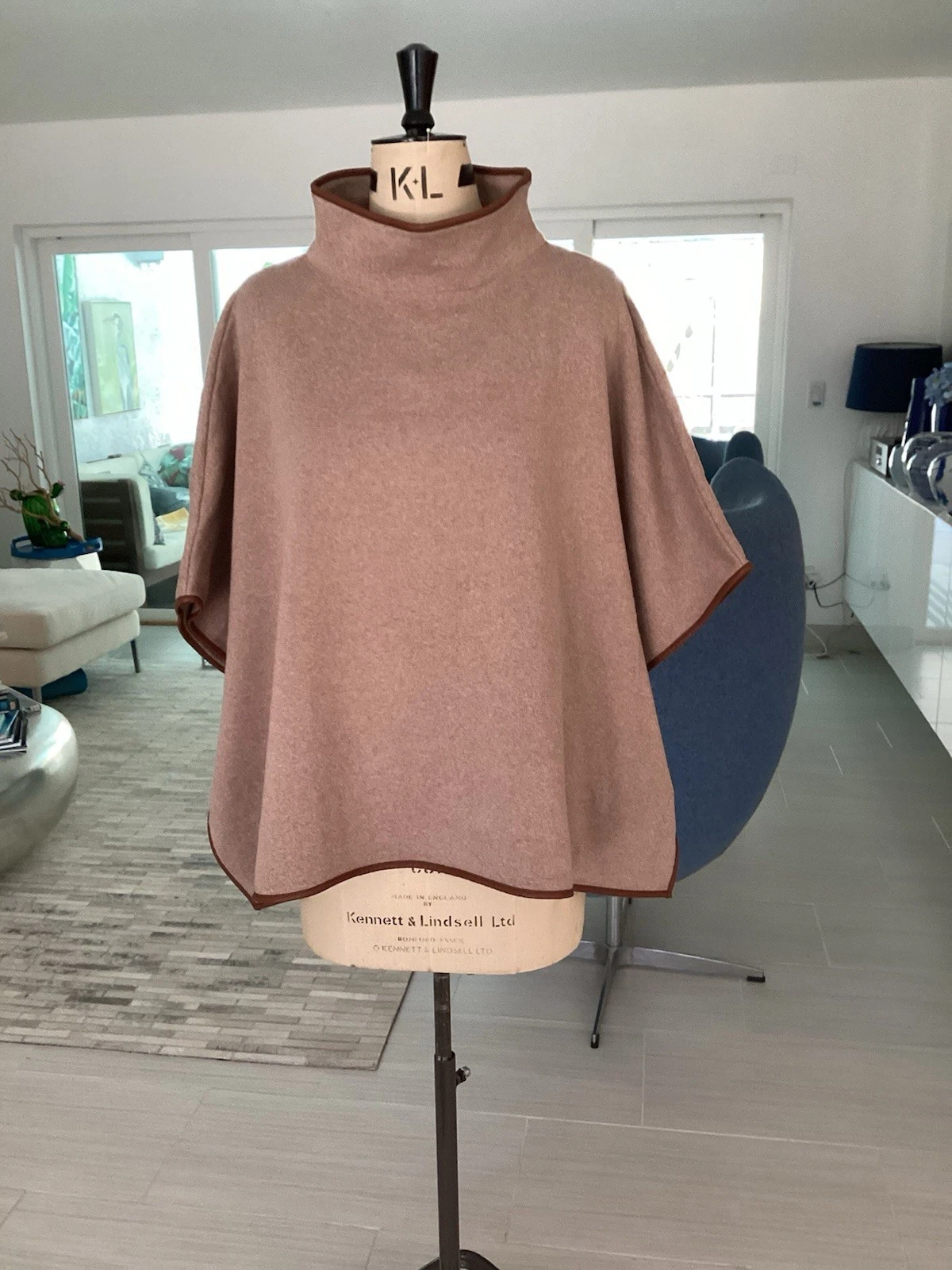 J. Crew poncho, brown beige..sold out at J. Crew, cotton with faux leather trim
Opens in a new windo