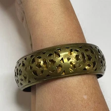 bangle bracelet believed to be brass tribal ethnic cut outs may be vintage 