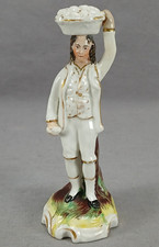 Mid 19th Century British Staffordshire Hand Painted Man Carrying Basket Figurine