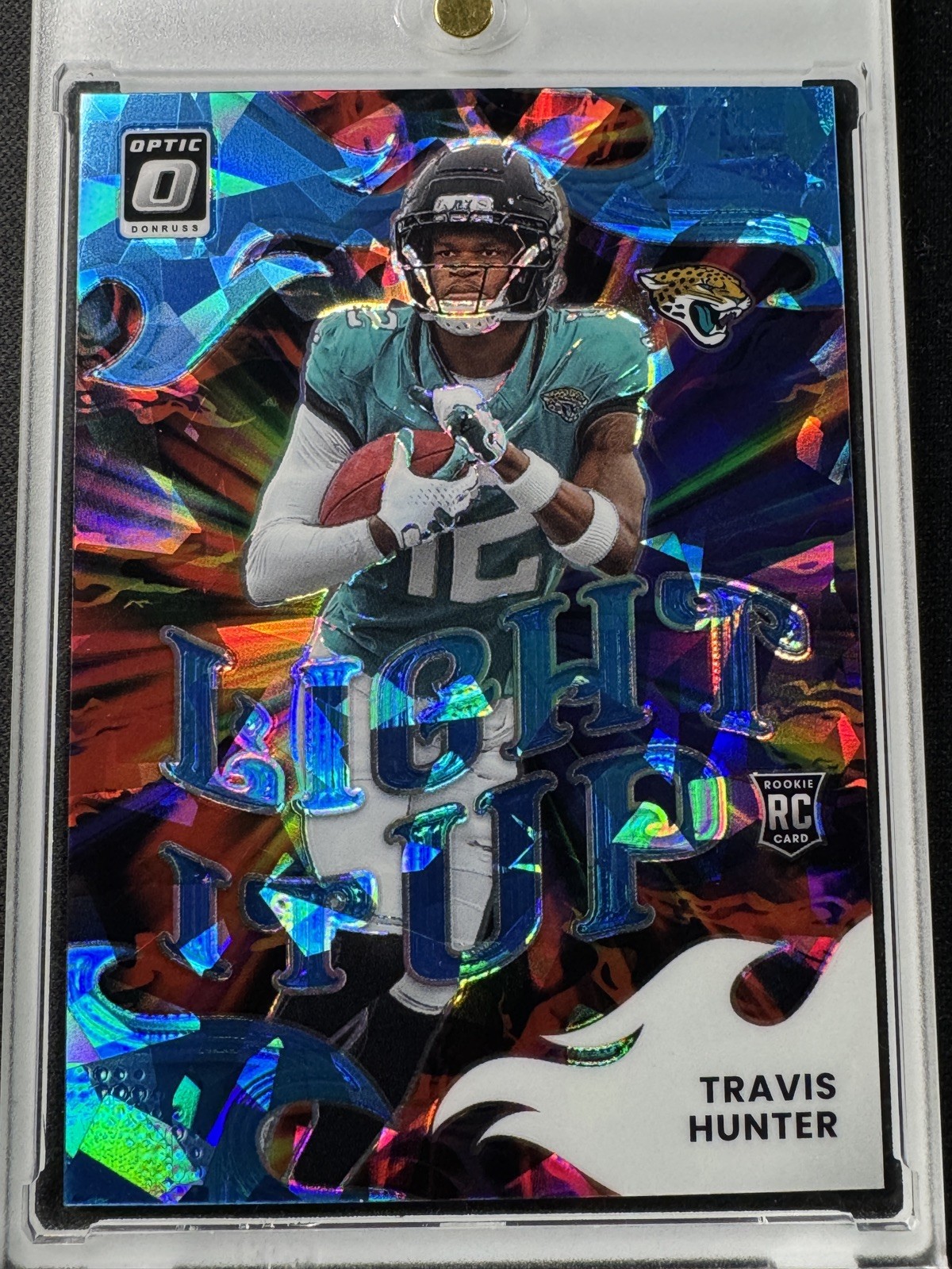 2025 Optic Travis Hunter Light It Up Blue Cracked Ice /55 Jacksonville Jaguars