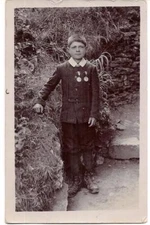 Young Boy Proudly Wearing Two Medals Badges Vintage Real Photo Postcard