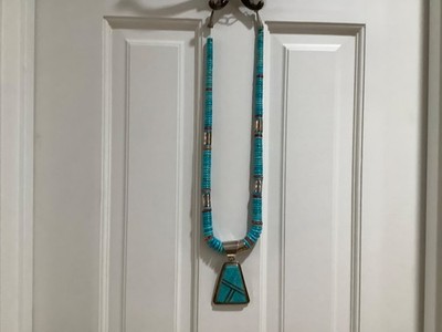 A handmade turquoise and sterling silver necklace